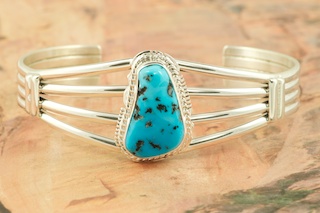 Genuine Sleeping Beauty Turquoise set in Sterling Silver Bracelet. The Sleeping Beauty Turquoise mine is located in Gila County, Arizona. Created by Navajo Artist Larson Lee. Signed by the artist.